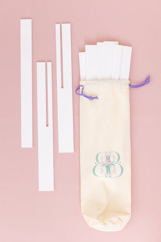 White Travel Racks Set of Four and One Pusher